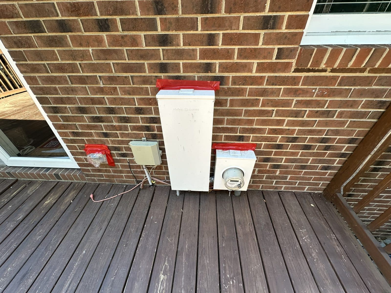 Home siding and deck after professional pressure washing