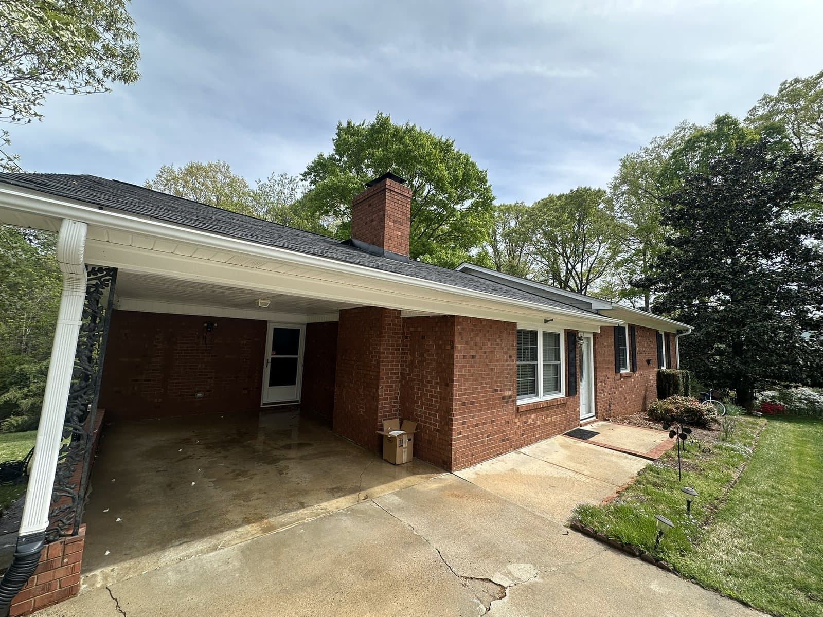 Clean concrete driveway after professional pressure washing